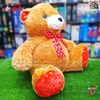 عروسک پولیشی خرس قهوه‌ای بزرگ با پاپیون قرمز قلبی – نرم، بغل‌کردنی و دوست‌داشتنی