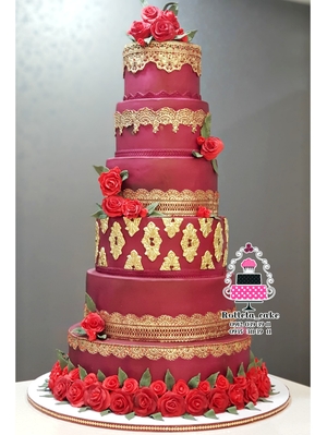 Red and gold wedding cake