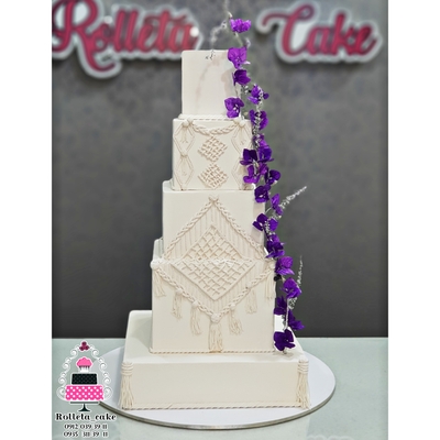 Wedding cake with purple flowers